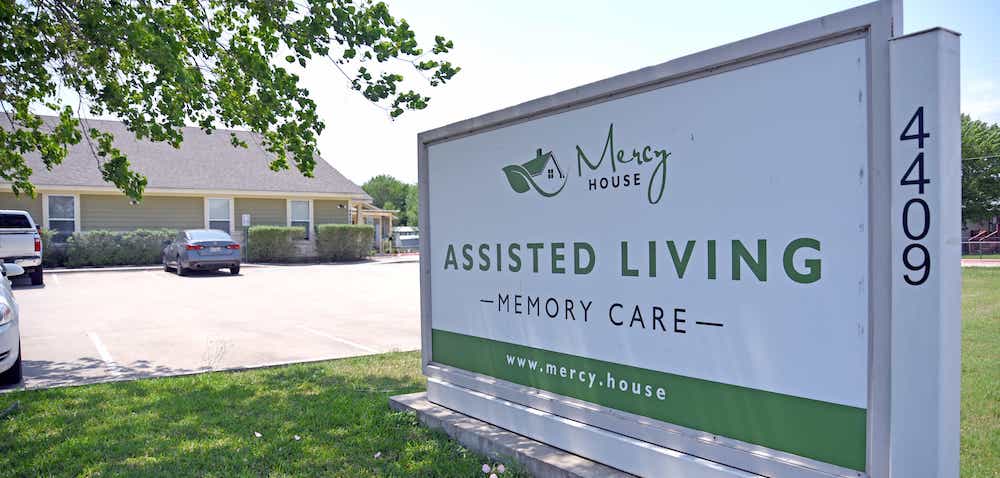 Exterior sign of Mercy House Assisted Living facility