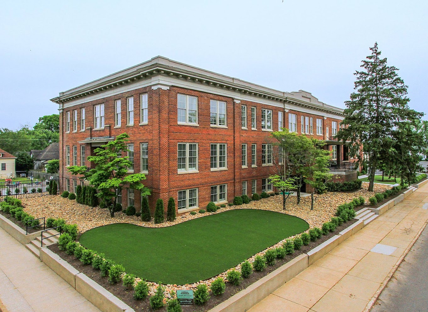 Exterior view of Oakwood Senior Living with landscaped gardens