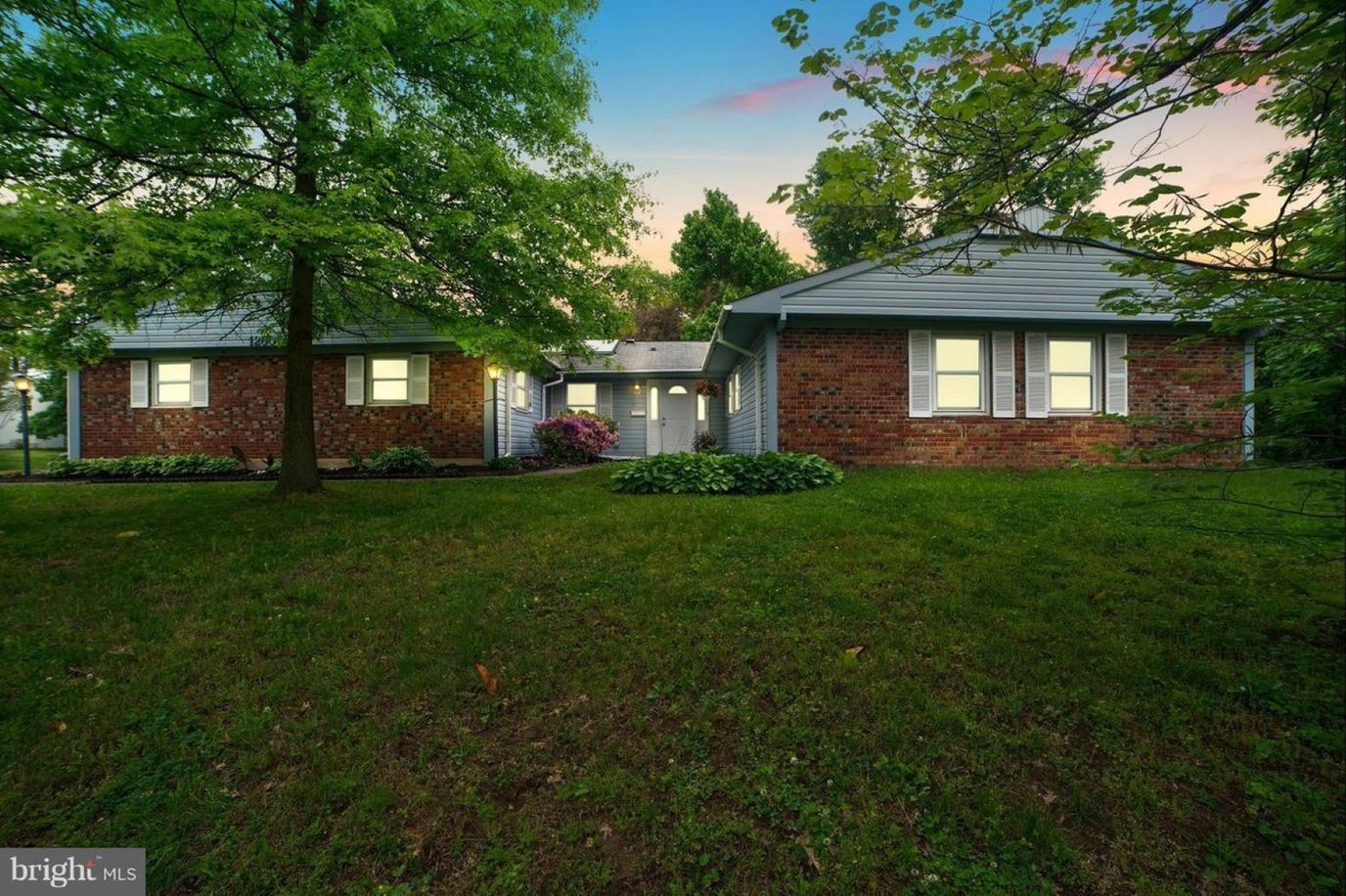 Exterior view of Ovalstone Comfort Home surrounded by trees