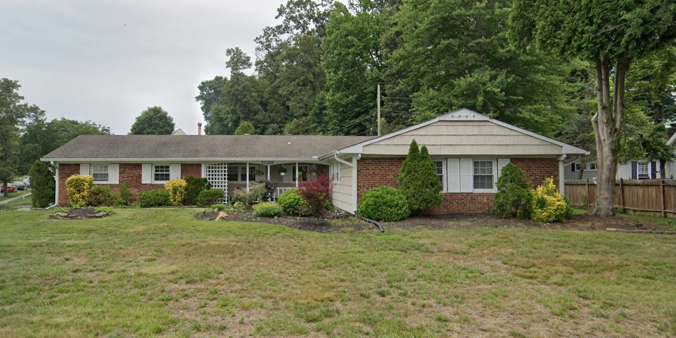 Exterior view of Ovalstone Comfort Home with landscaped area