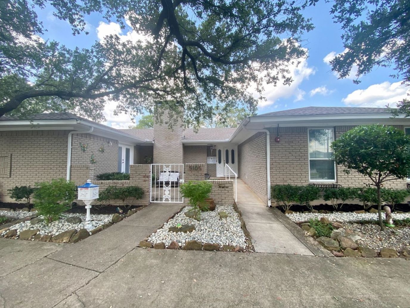 Exterior view of The Arbor Woods building entrance