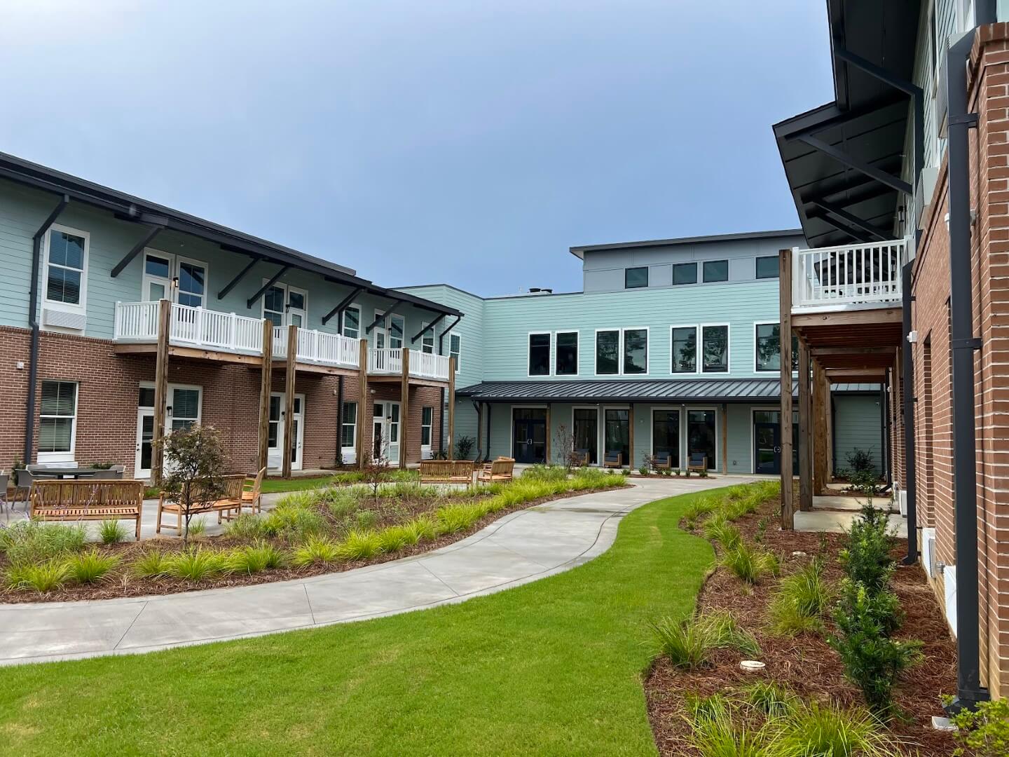 A winding pathway through a landscaped courtyard at the facility