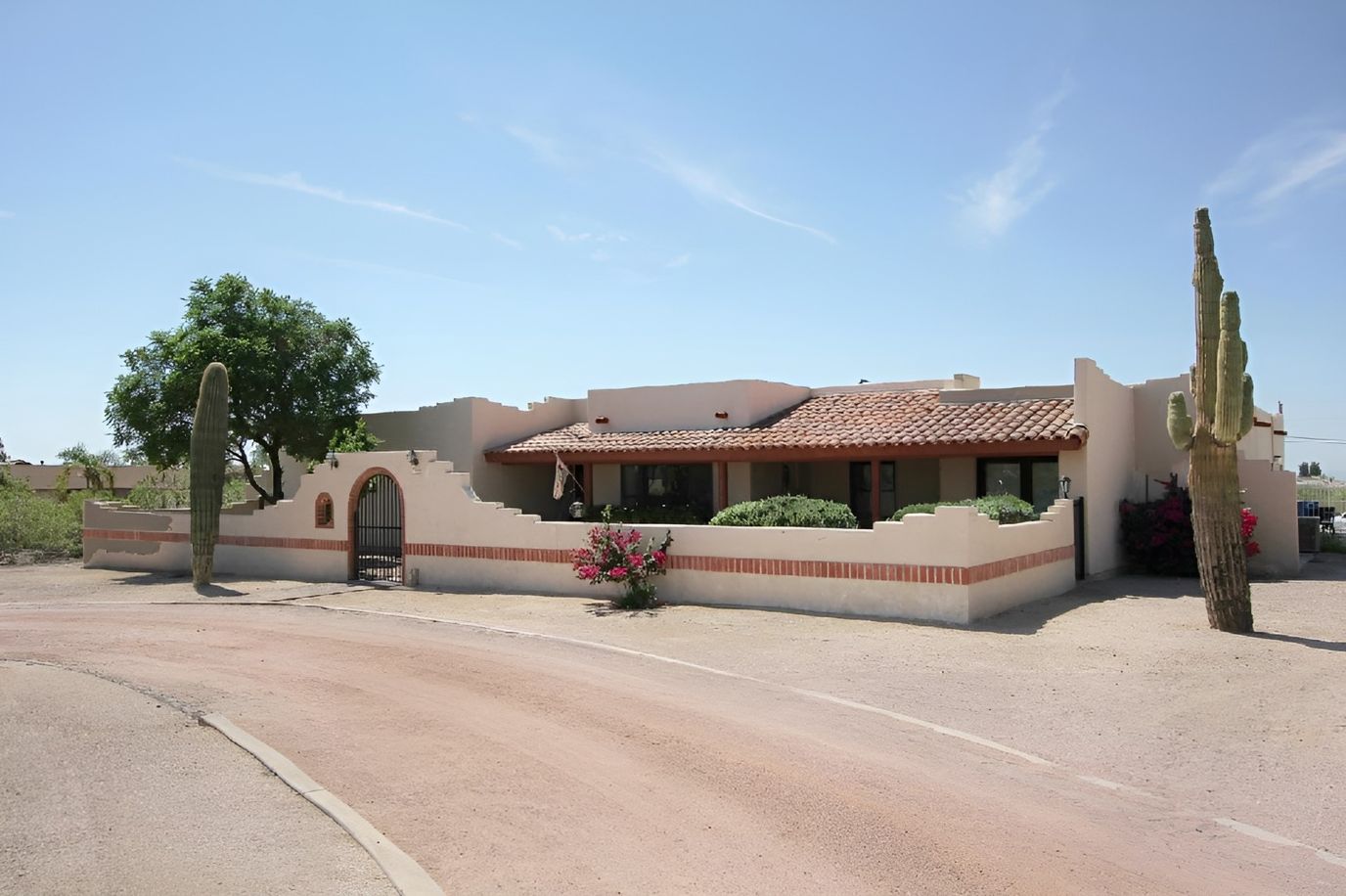 Exterior view of a southwestern-style building with landscaping