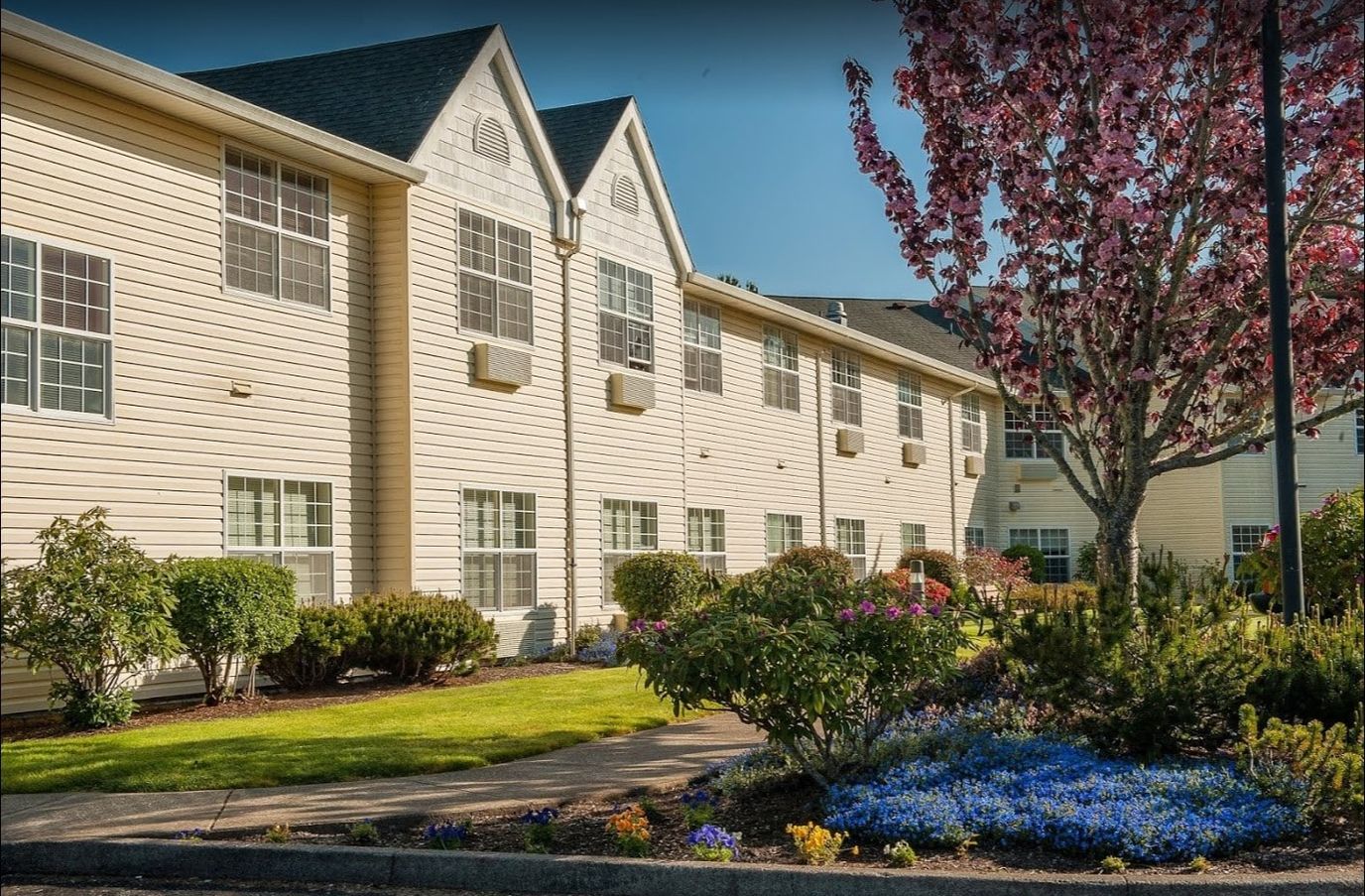Exterior view of Lakeview Senior Living with flowers and landscaping