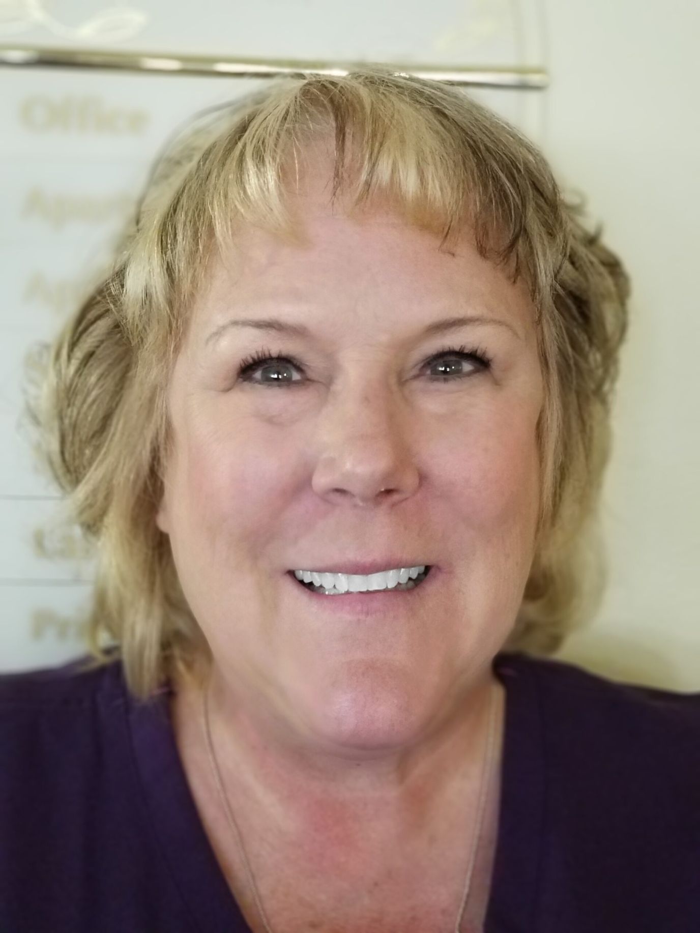 Ivy Manor of West Bend, assisted living in West Bend, WI — Smiling staff member in a senior living facility