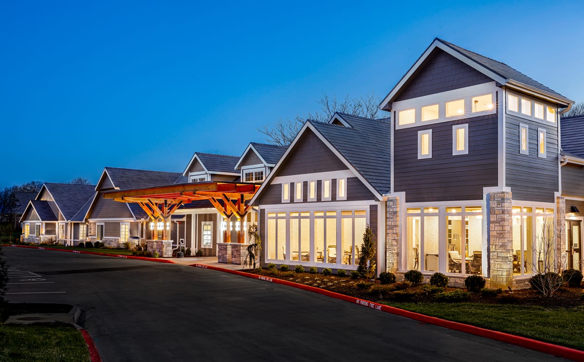 Exterior view of Homestead Estates Assisted Living at dusk