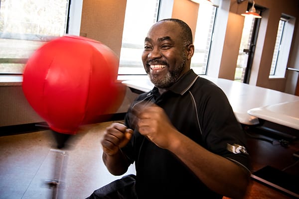Resident enjoying a recreational activity indoors