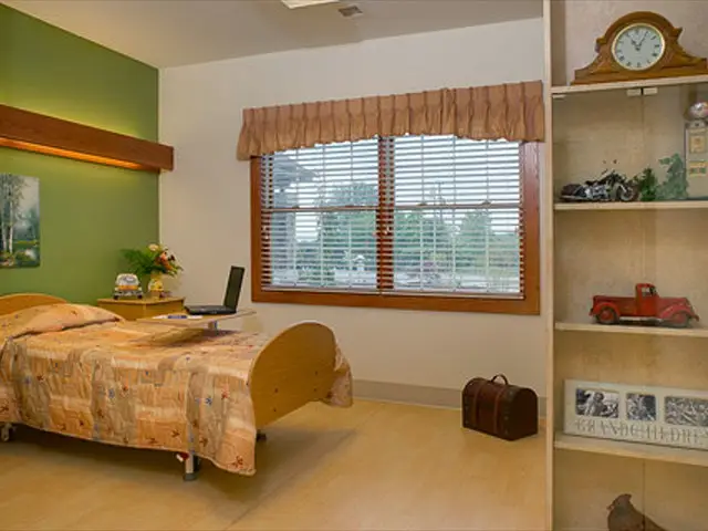 Cozy interior of a resident room with a bed and decor