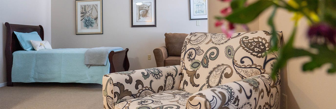 Cozy private resident room with decorated chair