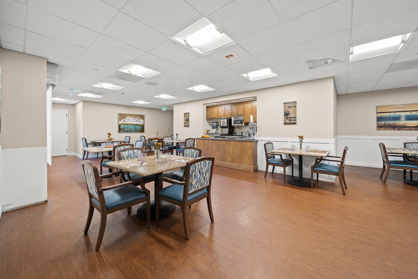 Bright dining room with tables and chairs