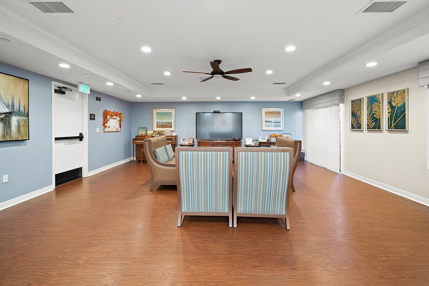Bright common area with comfortable seating and a television