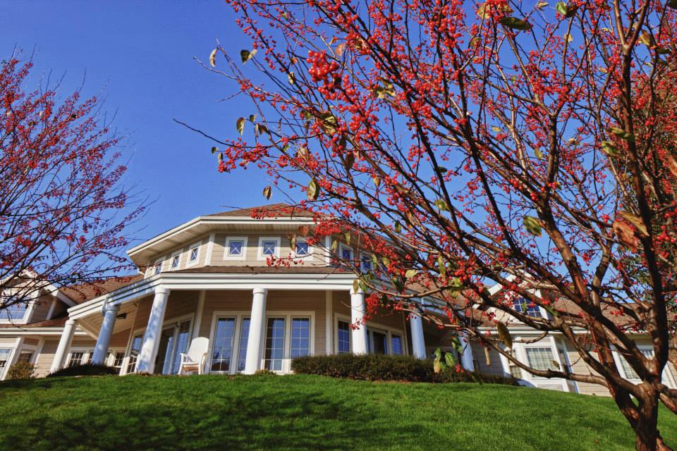 Exterior view of the facility with flowering trees