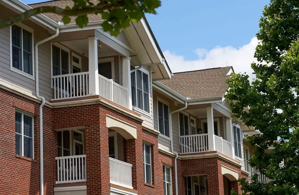 Exterior view of a senior living building with balconies