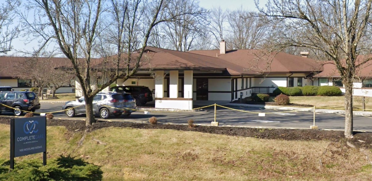 Exterior view of Complete Care at Woodlands facility