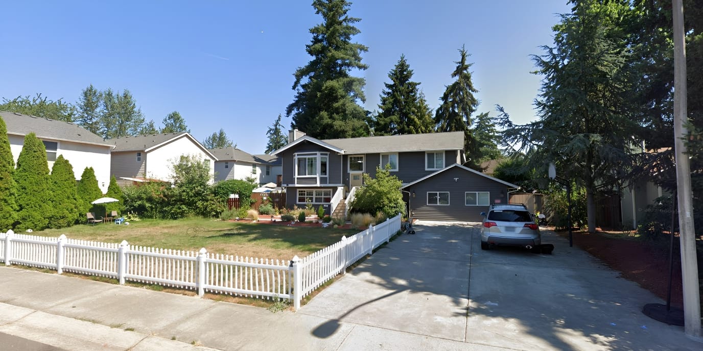 Exterior view of a residential facility with garden