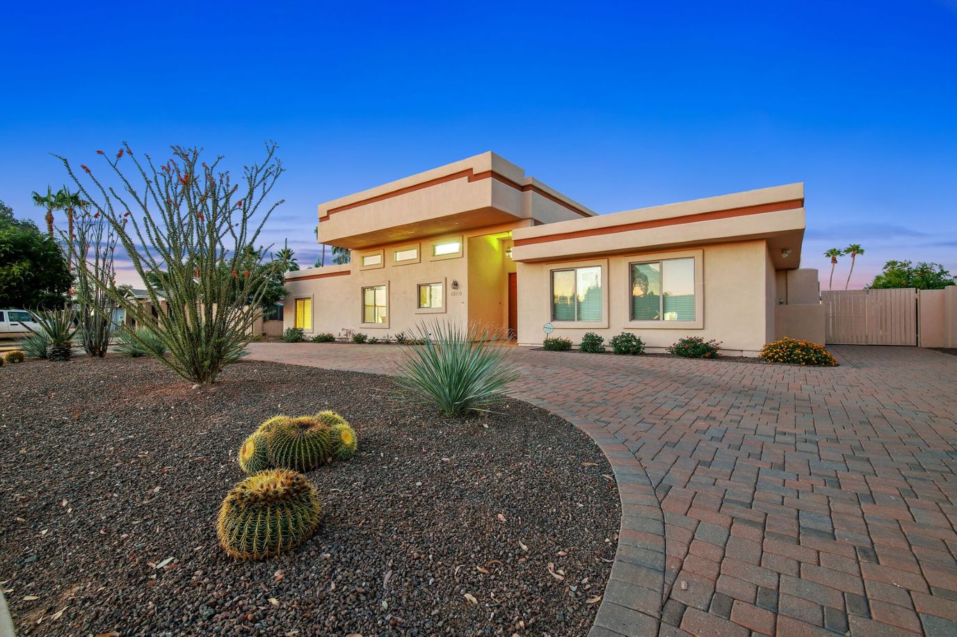 Exterior view of a senior living facility surrounded by desert landscaping