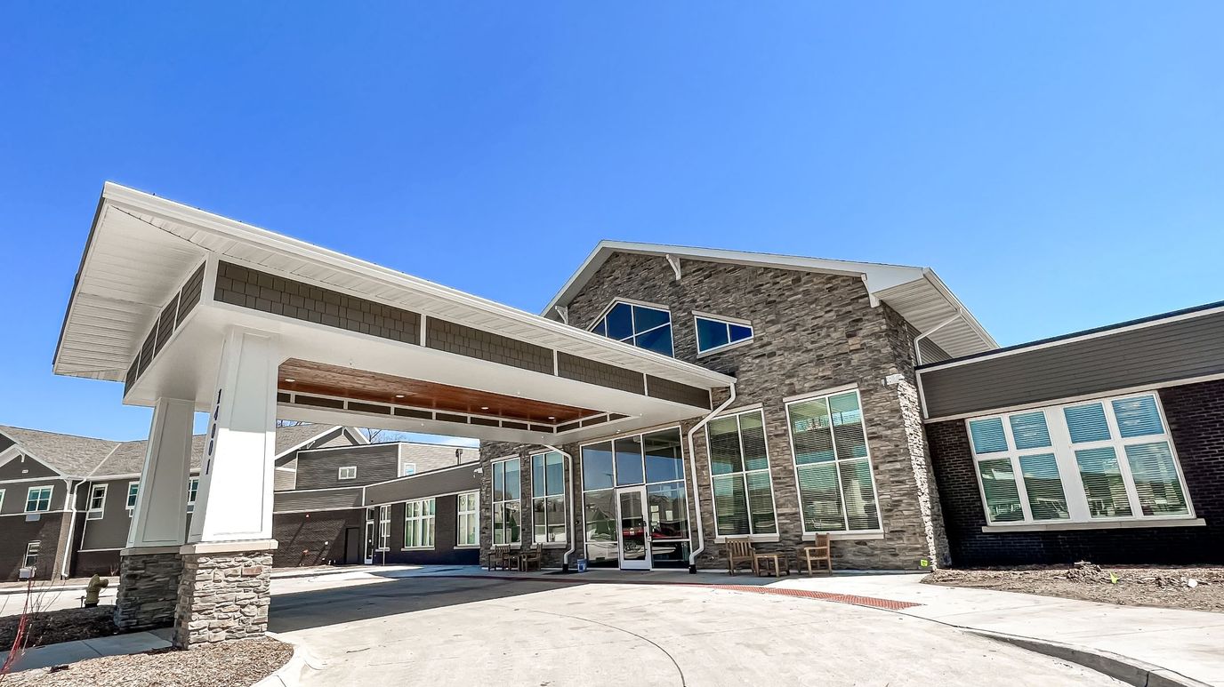 Building exterior with entrance and large windows