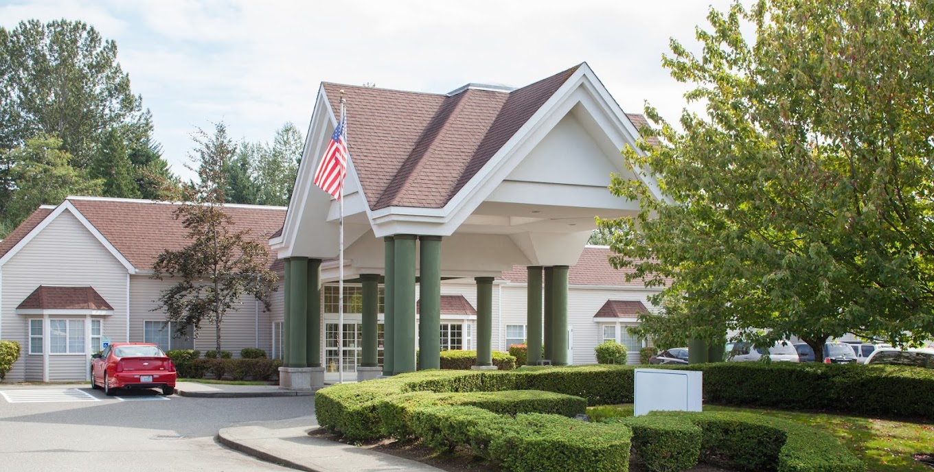 Exterior view of the Everett Center facility with flag