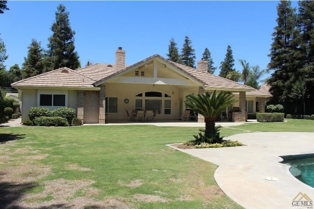 Exterior view of a senior care facility with a garden