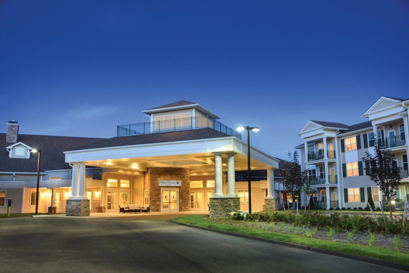 Exterior view of the facility entrance at dusk