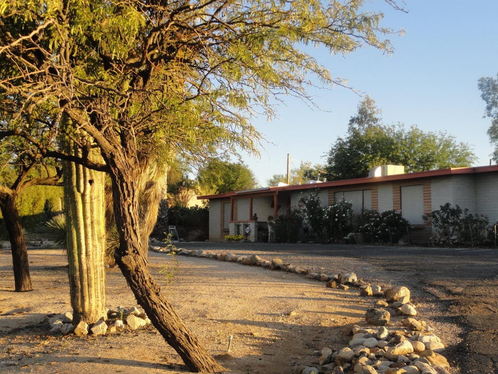 Exterior view of Morning Glory Assisted Living facility with garden