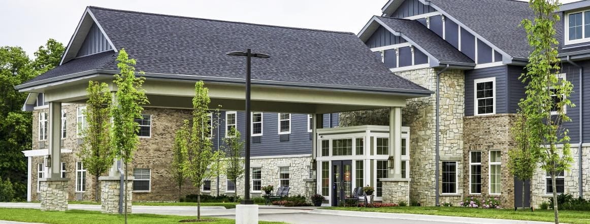 Exterior view of Provision Living facility with landscaping