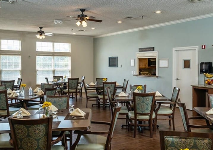 Bright dining room with tables set for meals