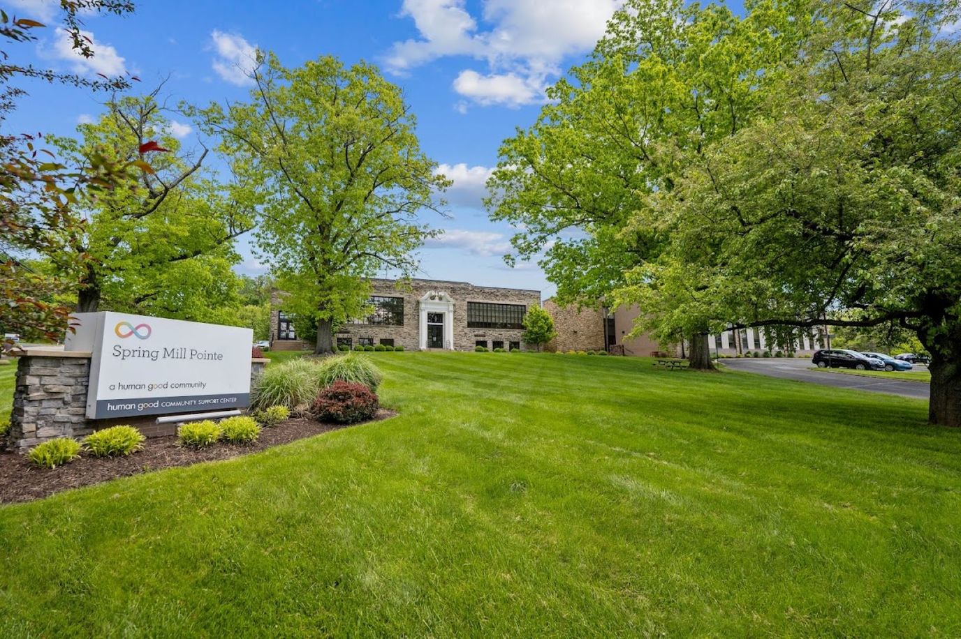 Exterior view of Spring Mill Pointe facility with landscaping