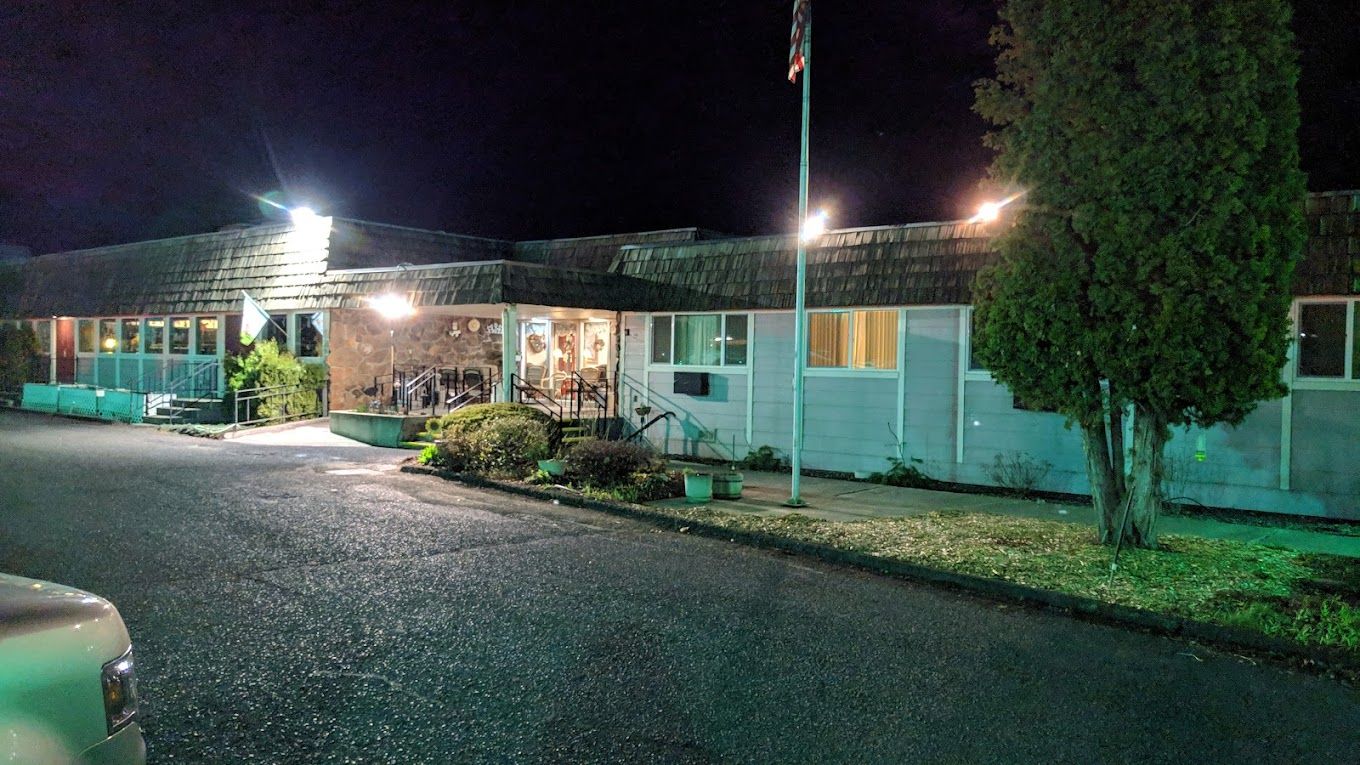 Exterior view of Sun Ridge Retirement facility at night
