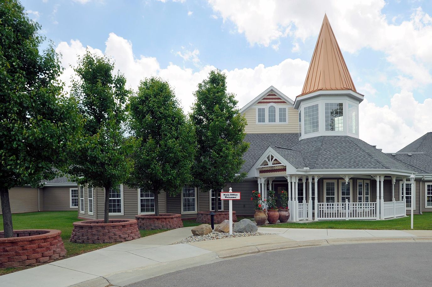 Beautiful building entrance with landscaping and gazebo