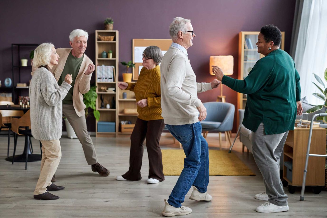 Poet’s Walk Leesburg, assisted living in Leesburg, VA — Seniors dancing joyfully in a vibrant common area