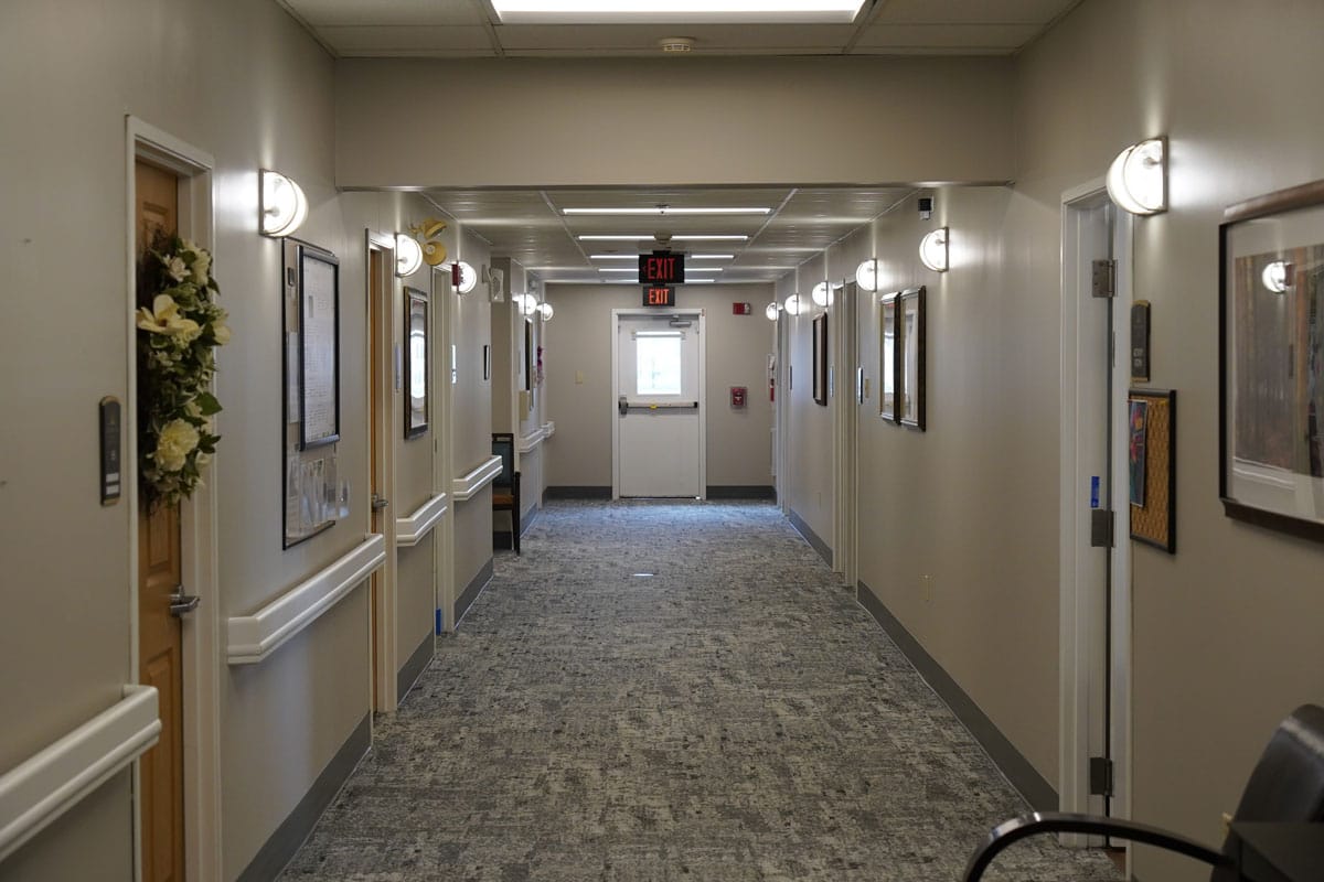 Bright hallway with doors and artwork