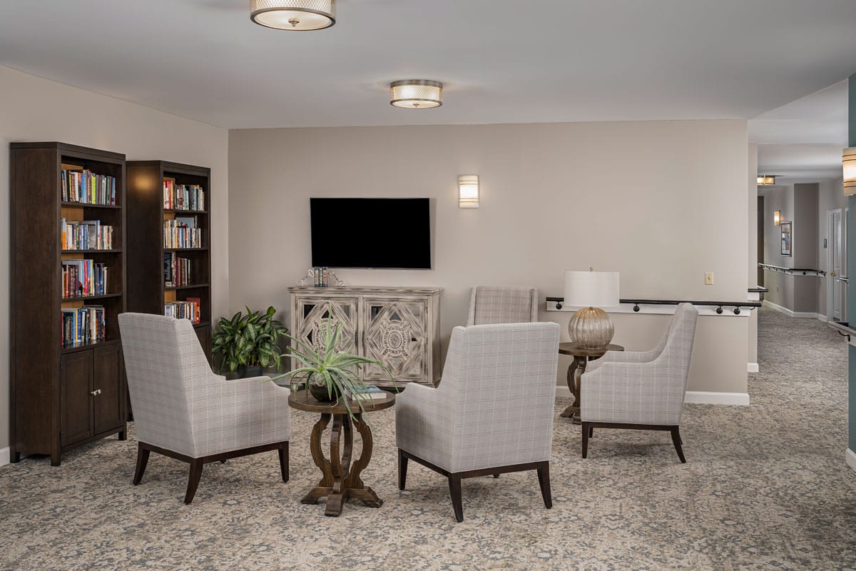 Common area with seating and bookshelf