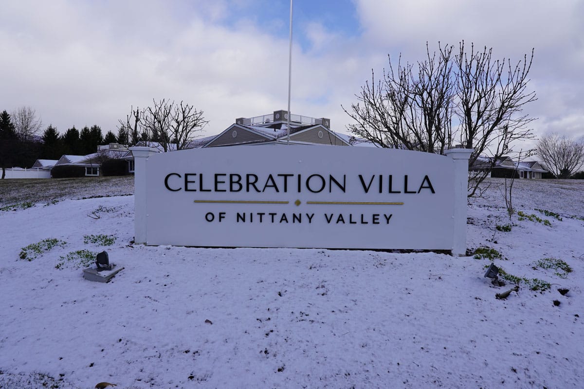 Signage for Celebration Villa of Nittany Valley in winter setting