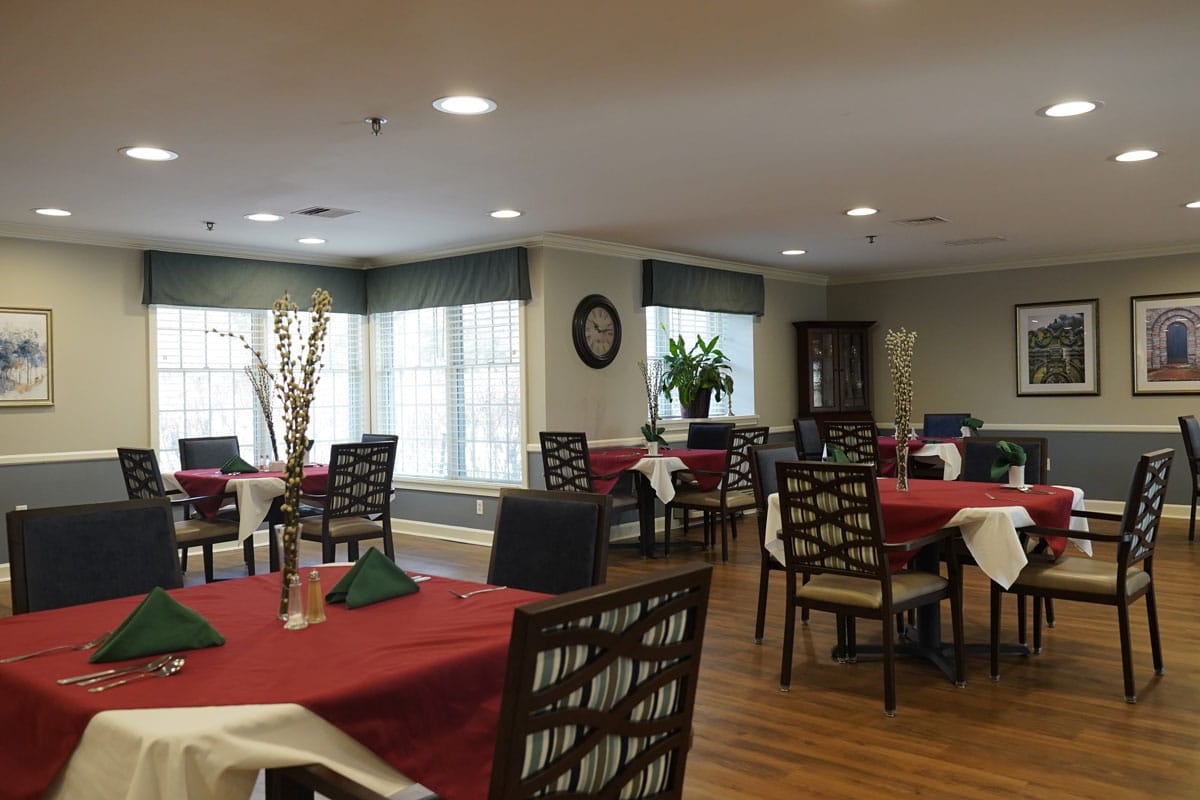 Interior of a dining area with tables set for meals