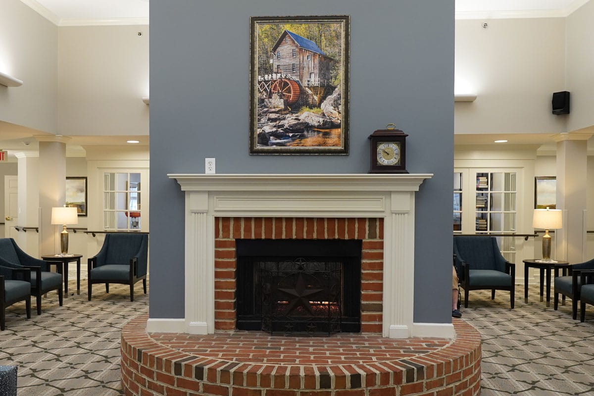 Cozy living room with a brick fireplace and decorative painting