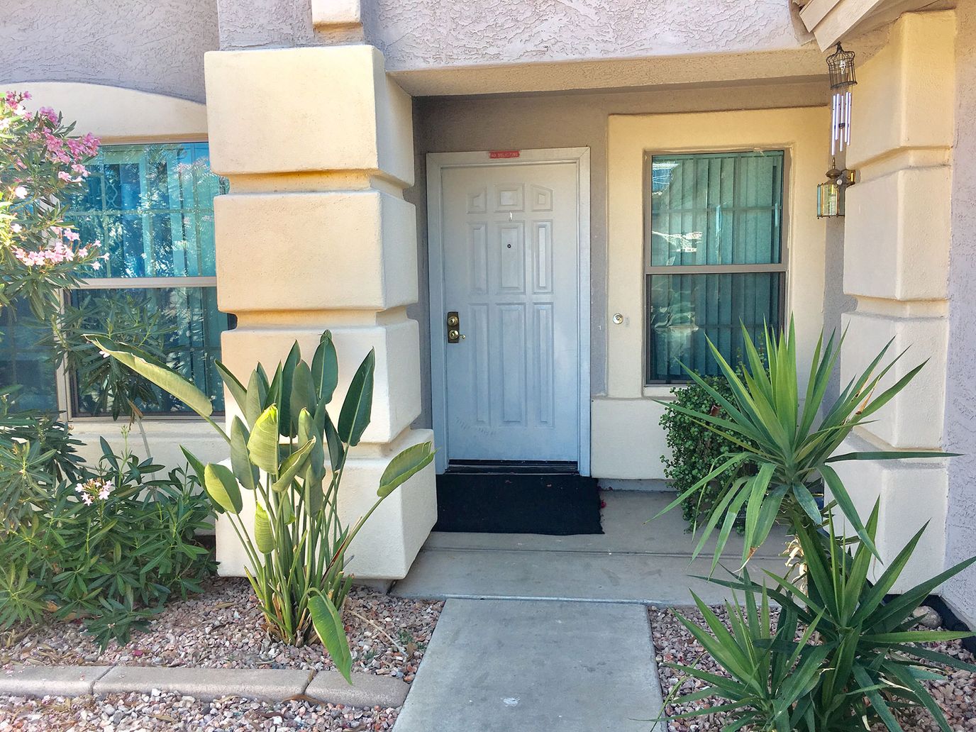 Entrance to a senior living facility with plants
