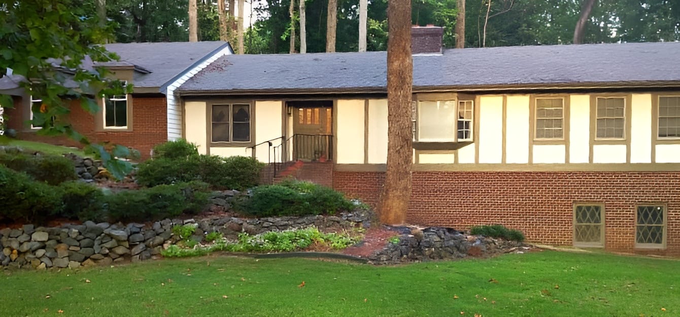 Exterior view of the facility building surrounded by landscaping