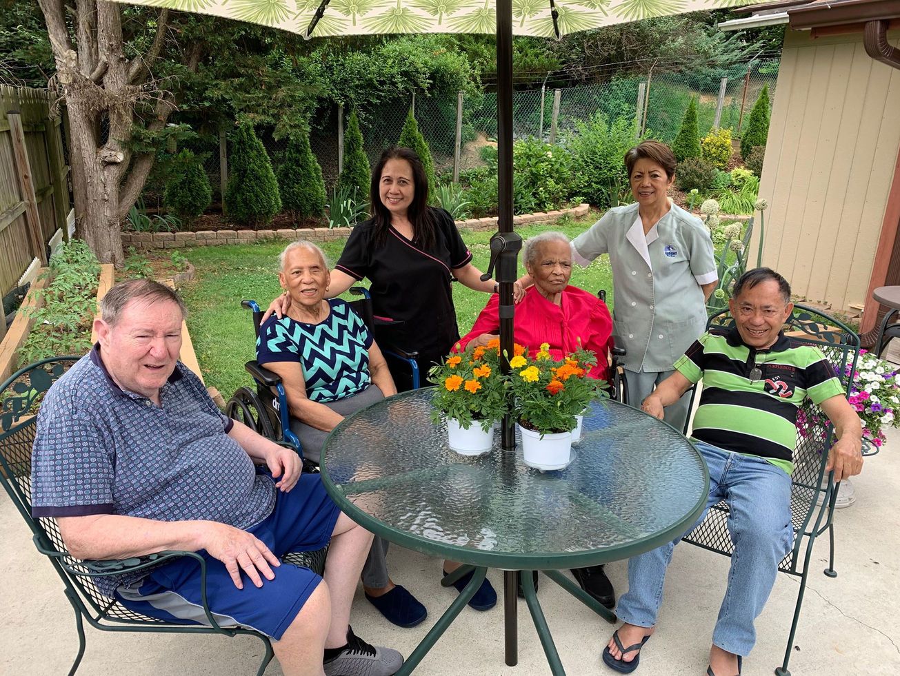 Residents enjoying time outdoors with staff