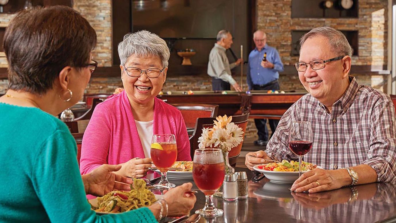Residents enjoying a meal together in a dining area