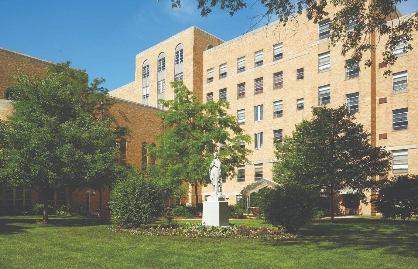 Exterior view of the facility with landscaped gardens