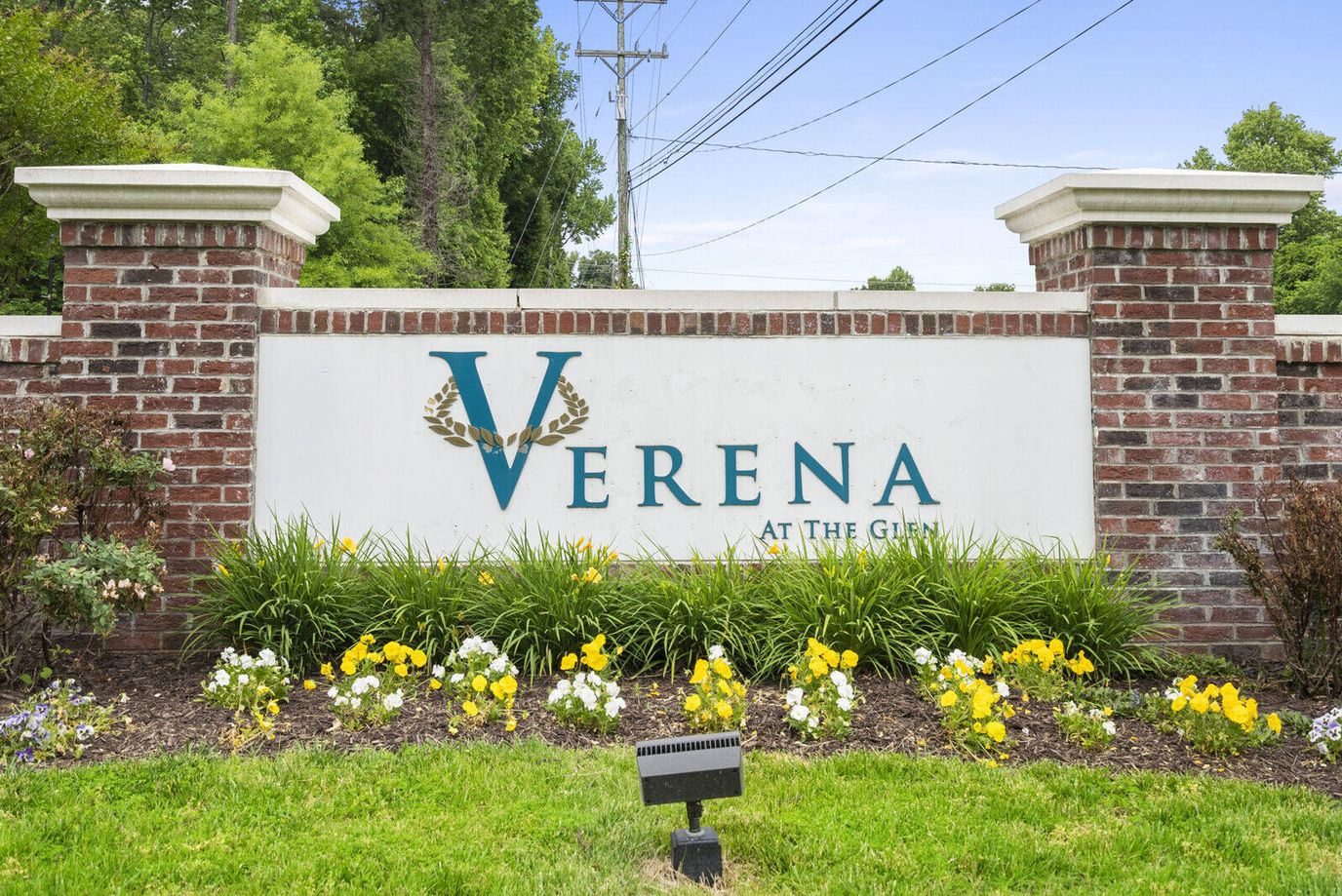 Facility logo sign with flowers in the foreground