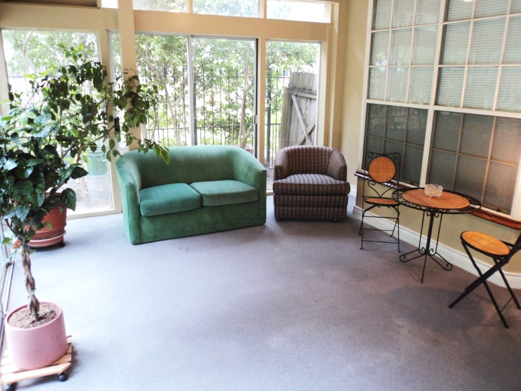 Bright common area with seating and plants