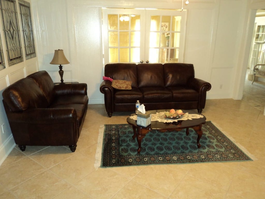 Cozy lounge area with leather sofas and decor