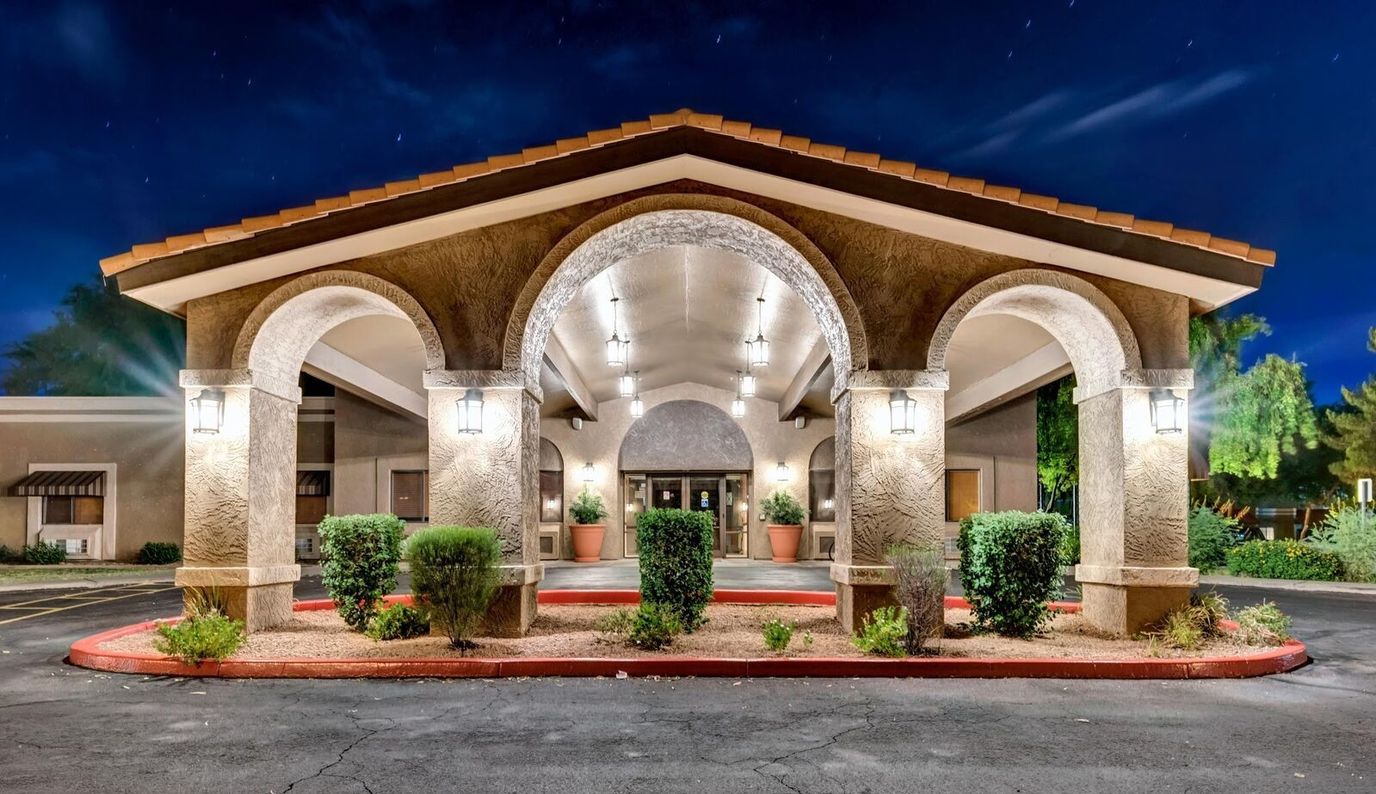 Exterior view of Springdale Village entrance at night