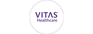 Allouez Senior Living Village 2, assisted living in Green Bay, WI — VITAS Healthcare company logo in purple text