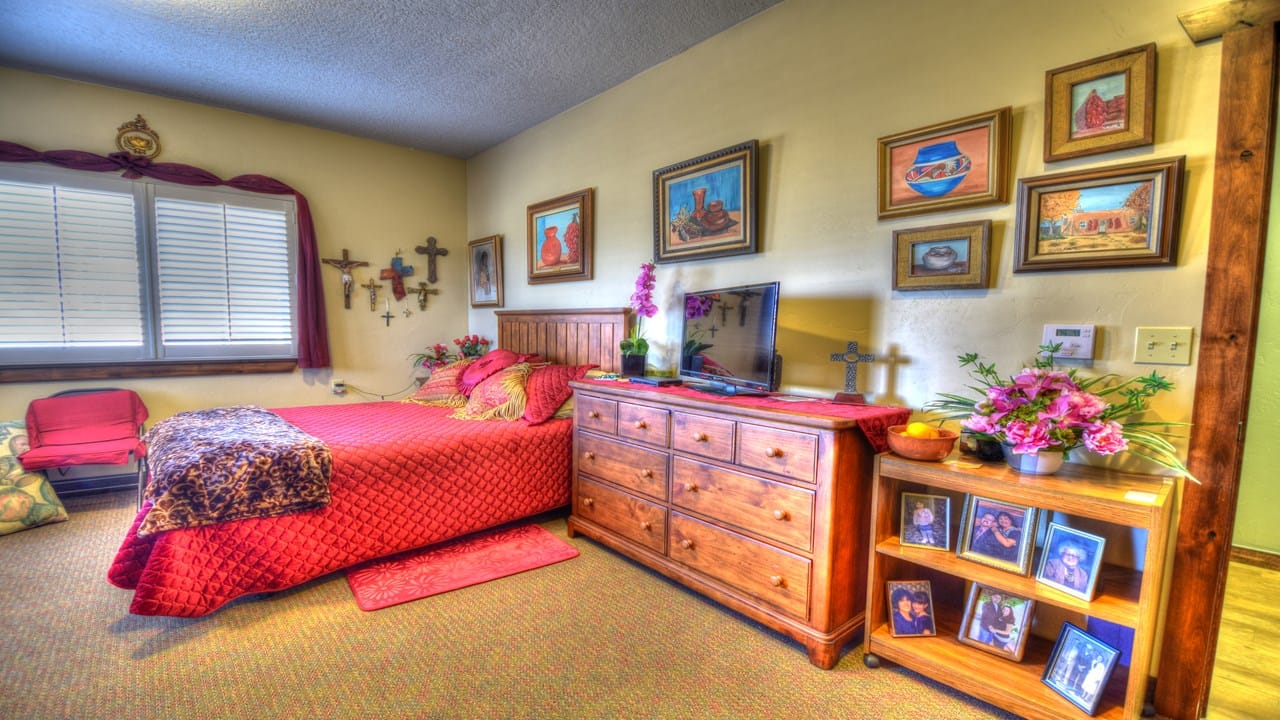 Cozy resident room with personal decorations and a bed