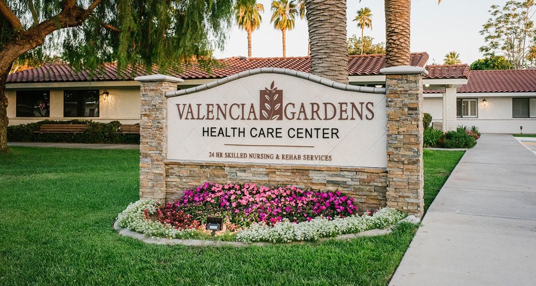 Exterior view of Valencia Gardens Health Care Center sign