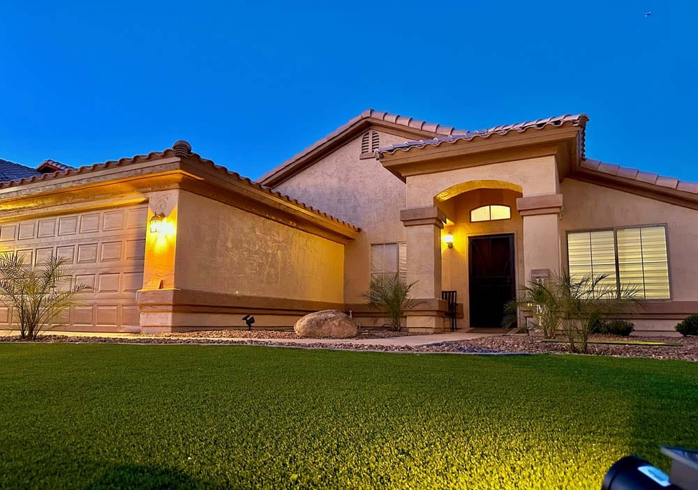 Exterior view of a well-lit assisted living facility