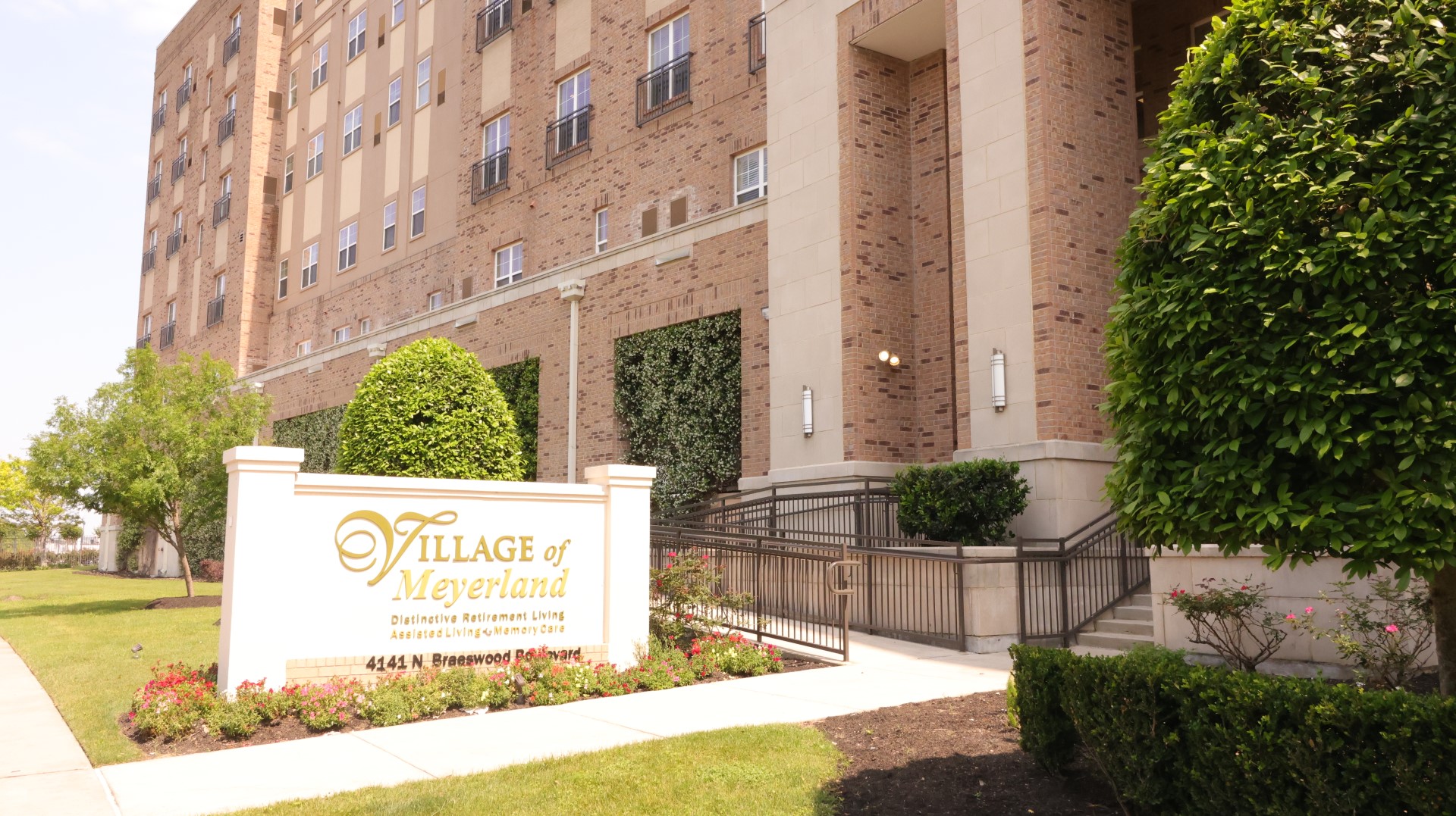 Exterior view of The Village of Meyerland with sign